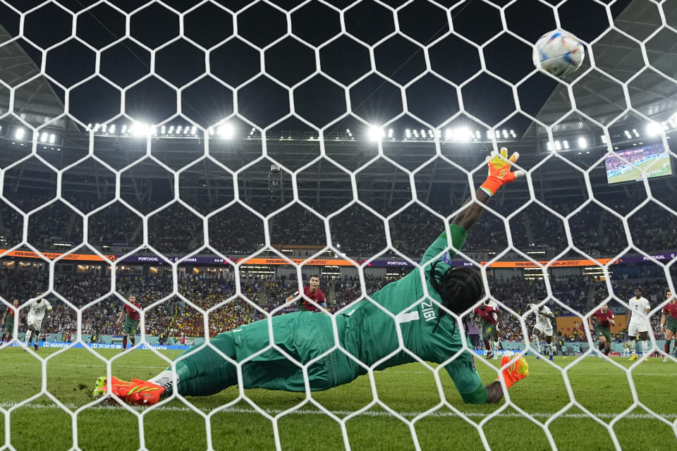 Portugal's Cristiano Ronaldo scores his side's opening goal on a penalty during the World Cup group H soccer match between Portugal and Ghana, at the Stadium 974 in Doha, Qatar, Thursday, Nov. 24, 2022. (AP Photo/Manu Fernandez)