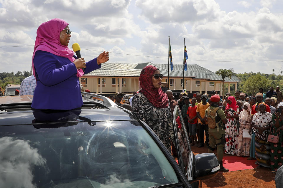 FILE - In this Tuesday, March 16, 2021, file photo, Tanzania's then Vice President Samia Suluhu Hassan, left, speaks during a tour of the Tanga region of Tanzania. Samia Suluhu Hassan has been sworn in Friday, March 19, 2021, as Tanzania's president, making history as the country's first woman in the position following the death of her predecessor John Magufuli. (AP Photo, File)