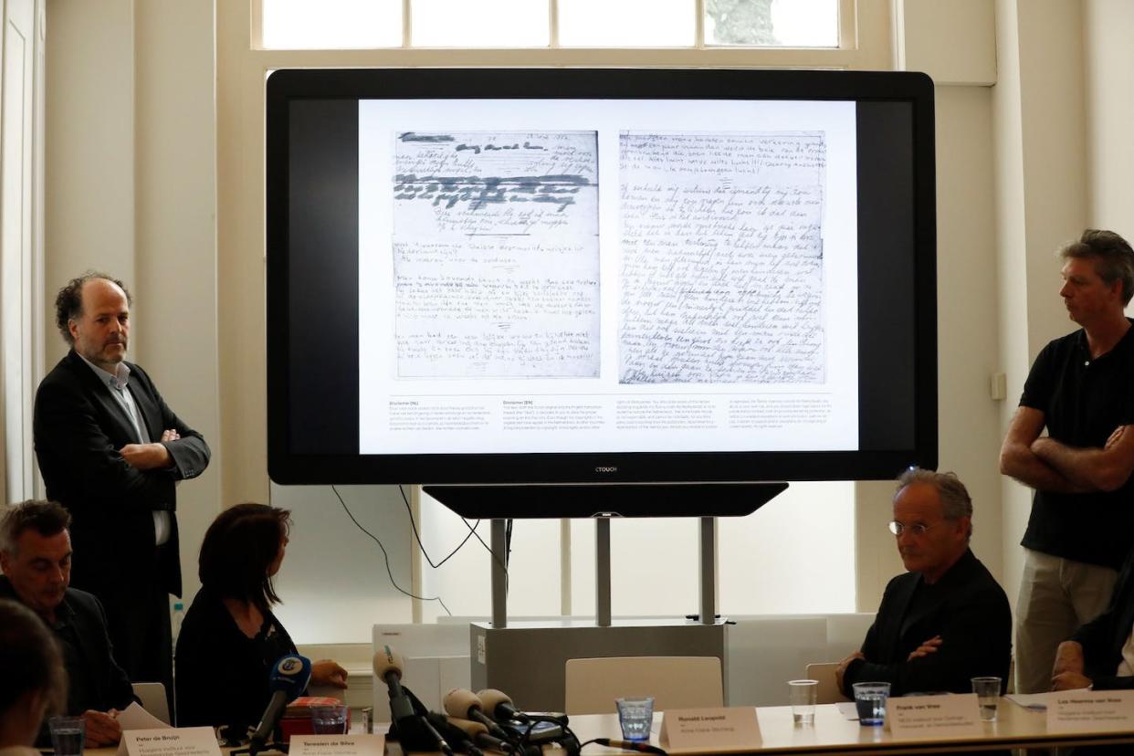 Anne Frank House Executive Director Ronald Leopold, left, presents pages of Anne Frank's diary. <a href="https://www.gettyimages.com/detail/news-photo/ronald-leopold-executive-director-of-the-anne-frank-house-news-photo/959018820?adppopup=true" rel="nofollow noopener" target="_blank" data-ylk="slk:Bas Czerwinski/AFP via Getty Images;elm:context_link;itc:0;sec:content-canvas" class="link ">Bas Czerwinski/AFP via Getty Images</a>
