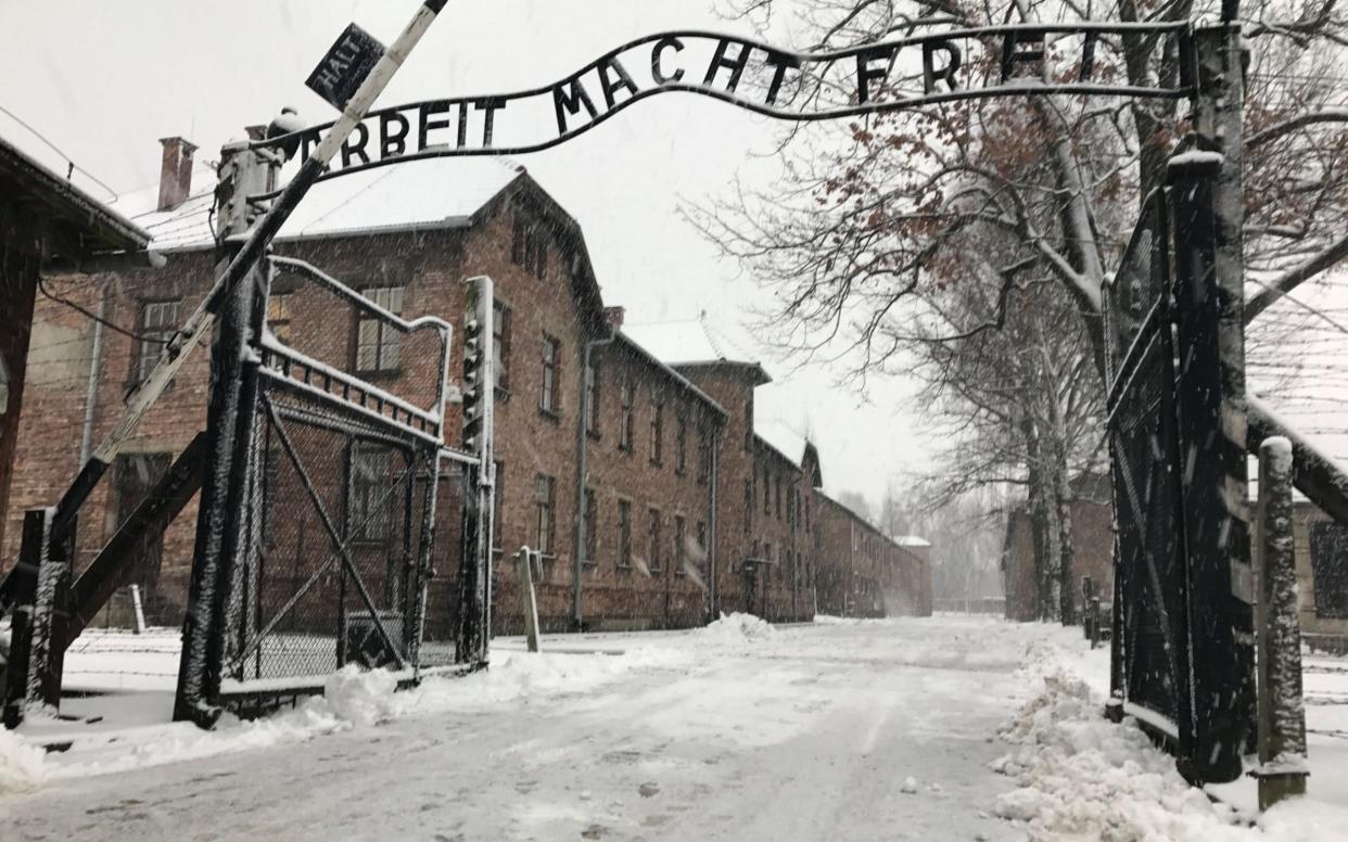 View of the entrance gates to Auschwitz concentration camp in Poland.  - PA