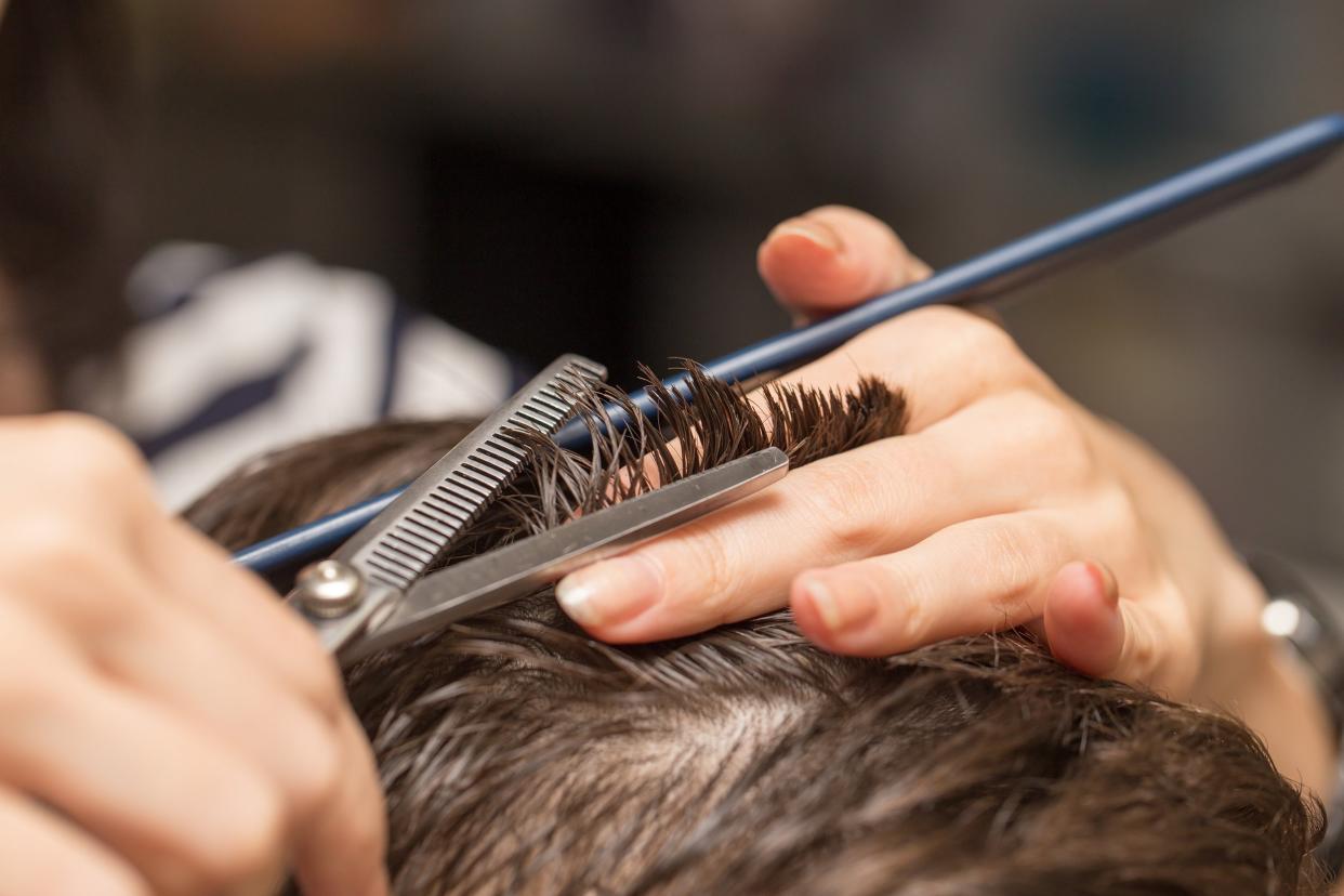 man getting hair cut