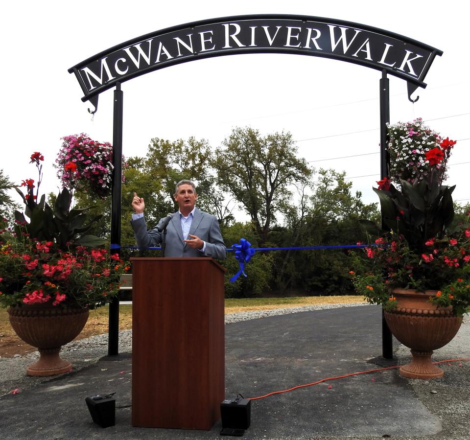 Tom Crawford, general manager for the McWane Ductile plant in Coshocton, talks at a ribbon cutting for the McWane River Walk, funded by $500,000 from the company.