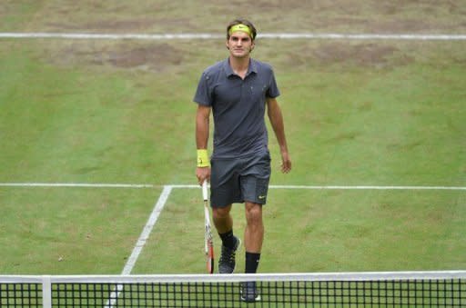 Switzerland's Roger Federer walks to the net after defeating Russia's Mikhail Youzhny in their semi-final at the ATP Gerry Weber Open in Halle, western Germany. Federer will face Germany's Tommy Haas in the final at Halle after both won their semi-finals