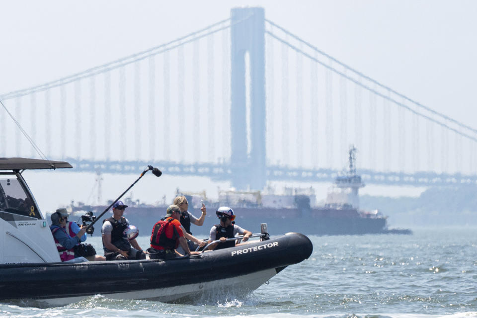 Lindsey Vonn, second from right, Olympic skiing champion, rides a USA SailGP Team chase boat during racing practice ahead of the New York Sail Grand Prix, Friday, June 21, 2024, in New York. (AP Photo/Julia Nikhinson)