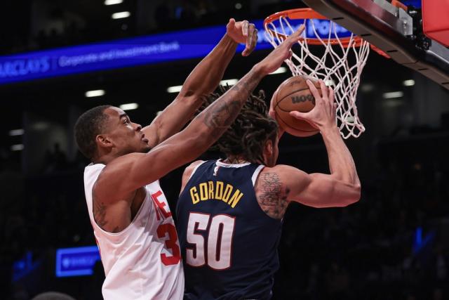 Denver Nuggets forward Aaron Gordon (50) drives to the basket as Brooklyn Nets center Nic Claxton (33) defends during the first quarter at Barclays Center.