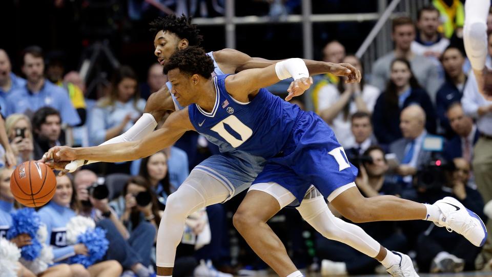 North Carolina guard Leaky Black, rear, and Duke forward Wendell Moore Jr. reach for a loose ball during the first half of an NCAA college basketball game in Chapel Hill, N.C., Saturday, Feb. 8, 2020.