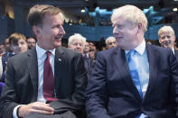 Jeremy Hunt, left, and Boris Johnson wait for the announcement of the result in the ballot for the new Conservative party leader, in London, Tuesday, July 23, 2019. Brexit hardliner Boris Johnson won the contest to lead Britain's governing Conservative Party on Tuesday and will become the country's next prime minister, tasked with fulfilling his promise to lead the U.K. out of the European Union "come what may." (Stefan Rousseau/Pool photo via AP)