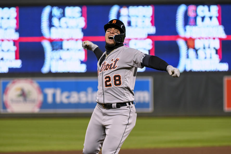 Detroit Tigers shortstop Javier Baez celebrates as he rounds the basses after hitting a three-run home run against the Minnesota Twins during the eighth inning of a baseball game Tuesday, April 26, 2022, in Minneapolis. The Twins won 5-4. (AP Photo/Craig Lassig)