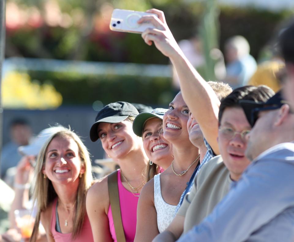 A group takes a selfie at the Desert Smash charity celebrity event at La Quinta Resort in La Quinta, Calif., March 7, 2023.