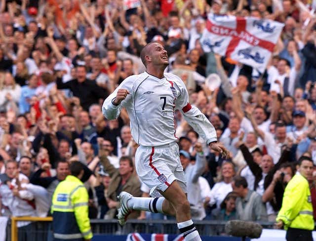 England captain David Beckham celebrates his last-minute equaliser against Greece.