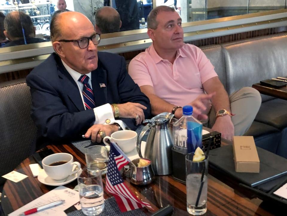 <div class="inline-image__caption"><p>Rudy Giuliani and Ukrainian-American businessman Lev Parnas at the Trump International Hotel in Washington.</p></div> <div class="inline-image__credit">Aram Roston/Reuters</div>