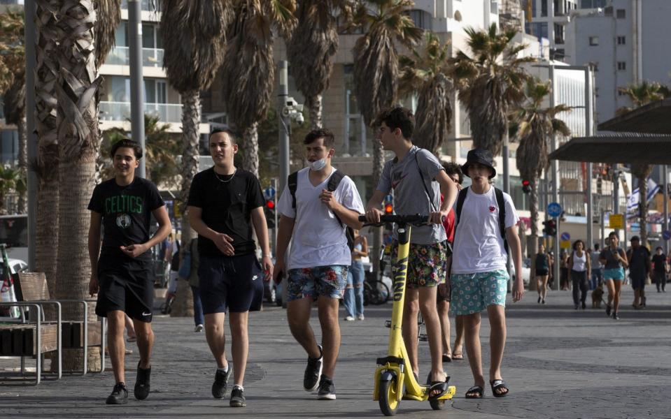 Outdoor wearing of face masks is no longer required in Israel following its sharp decline in Covid infection rates - Mostafa Alkharouf/nadolu Agency via Getty Images