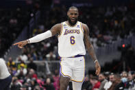 Los Angeles Lakers forward LeBron James (6) reacts after scoring against the Washington Wizards during the first half of an NBA basketball game, Sunday, Dec. 4, 2022, in Washington. (AP Photo/Jess Rapfogel)