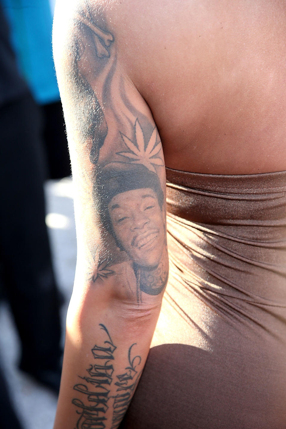 Amber Rose had Wiz Khalifa’s face on her arm once upon a time. She’s had it covered up post breakup. (Photo: Getty Images)