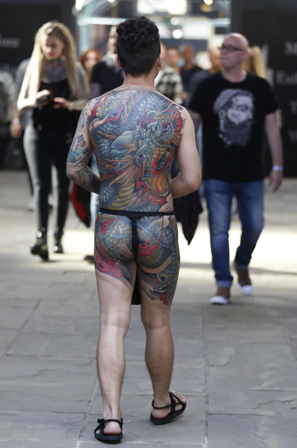 <p>A visitor displays his tattoos at The International Tattoo Convention in London, Friday, Sept. 22, 2017. (Photo: Kirsty Wigglesworth/AP) </p>