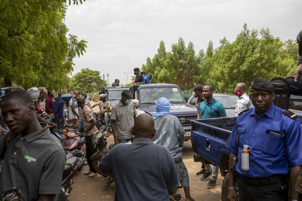 Malian police gather outside the Bourse du Travail where striking workers gathered to protest the arrest of President Bah N'Daw and Prime Minister Moctar Ouane by military personnel in Bamako, Mali, Tuesday May 25, 2021. Their detentions came just hours after a government reshuffle left out two members of the junta that seized power in a coup nine months earlier. The African Union, United Nations and West African regional bloc are calling for their immediate release. (AP Photo)