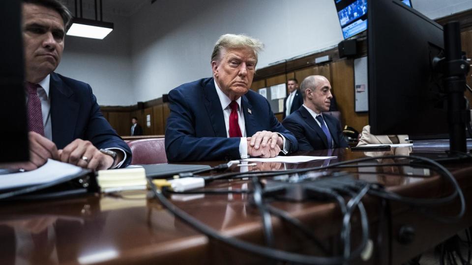 Former president Donald Trump sits in Manhattan criminal court