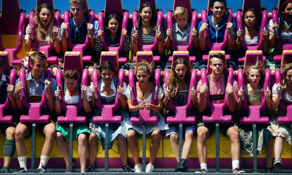 Visitors ride a roller coaster during the 183rd Oktoberfest in Munich