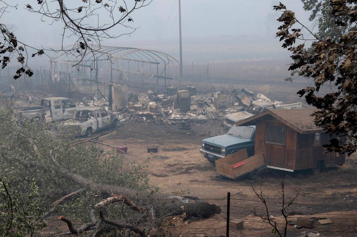 The remains of a residence in Klamath River along Highway 96 as the McKinney Fire burns in Klamath National Forest in Siskiyou County on Monday, Aug. 1, 2022.