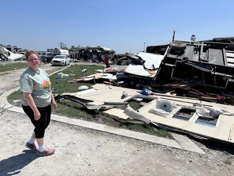 Amber Bryant stands near her RV on Sunday, May 26, 2024, after severe storms moved through the area. Bryant said she was pinned in her trailer and used her key fob to signal SOS.