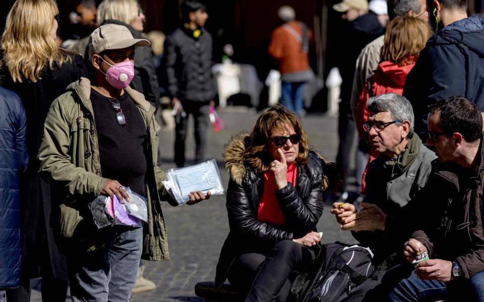 A street vendor sells protective masks to Piazza Navona on March 4, 2020 in Rome, Italy - tefano Montesi - Corbis/
