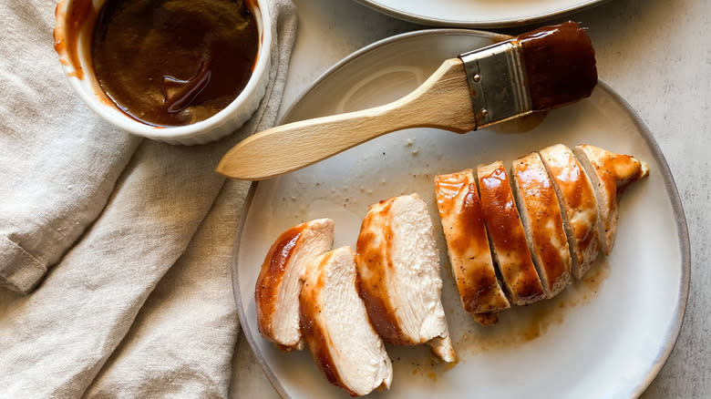 sliced chicken with paintbrush