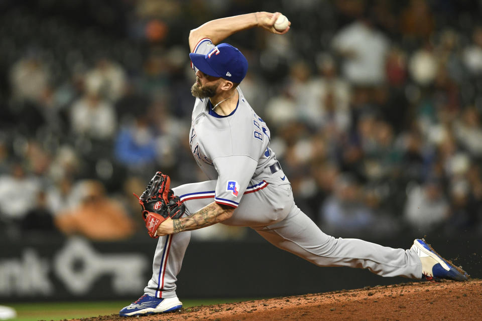 Texas Rangers relief pitcher Joe Barlow throws to a Seattle Mariners batter during the eighth inning of a baseball game Wednesday, Sept. 28, 2022, in Seattle. (AP Photo/Caean Couto)