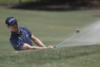 Justin Thomas hits from a trap on the second hole during the first round of the RBC Heritage golf tournament, Thursday, June 18, 2020, in Hilton Head Island, S.C. (AP Photo/Gerry Broome)