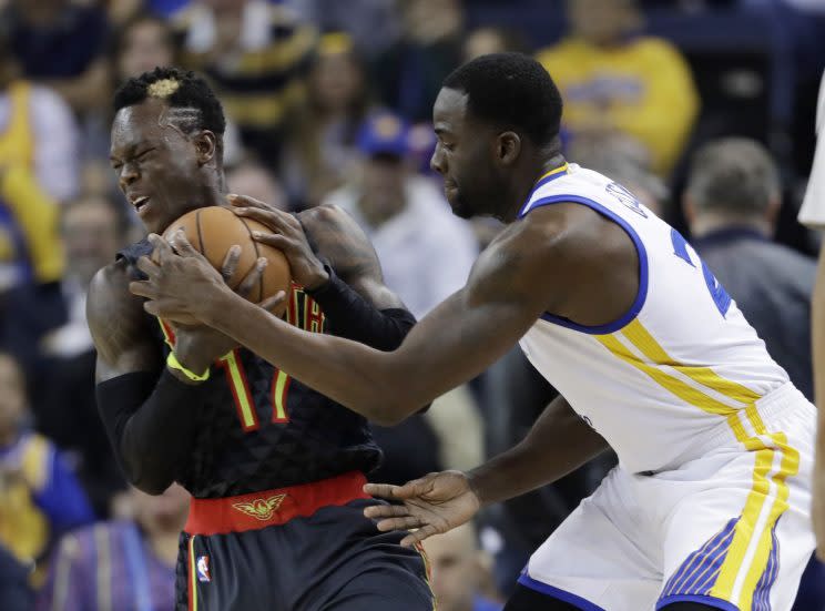 Draymond Green blocked Dennis Schröder in the final minute on Monday. (Associated Press)