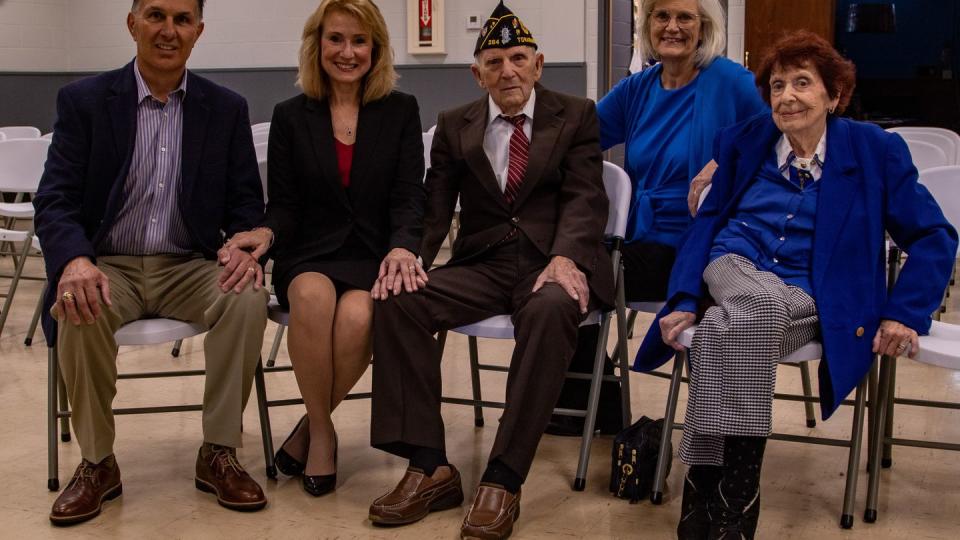 Ken Fabozzi, left, Tina Fabozzi, John Gojmerac, Linda Naples and Jean Gojmerac pose for a photo before a ceremony at Veterans of Foreign Wars Post #7575 in Tonawanda, New York, Oct. 20, 2023. Gojmerac, a WWII veteran who served with the 3rd Infantry Division, earned the insignia of Knight of the Legion of Honor for his actions in combat. (Sgt. William Griffen/Army)