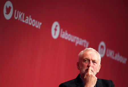 Britain's opposition Labour Party leader Jeremy Corbyn listens as Shadow Chancellor John McDonnell (not pictured) delivers his keynote speech at the Labour party Conference venue in Brighton, Britain, September 25, 2017. REUTERS/Toby Melville