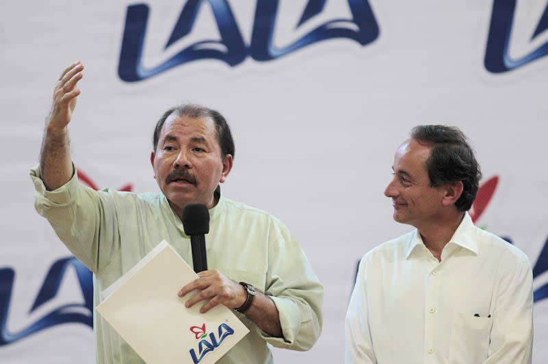 FILE PHOTO: Nicaragua's President Daniel Ortega and Chairman of the board of Grupo LALA Eduardo Tricio take part in the inauguration ceremony of a dairy plant at San Benito