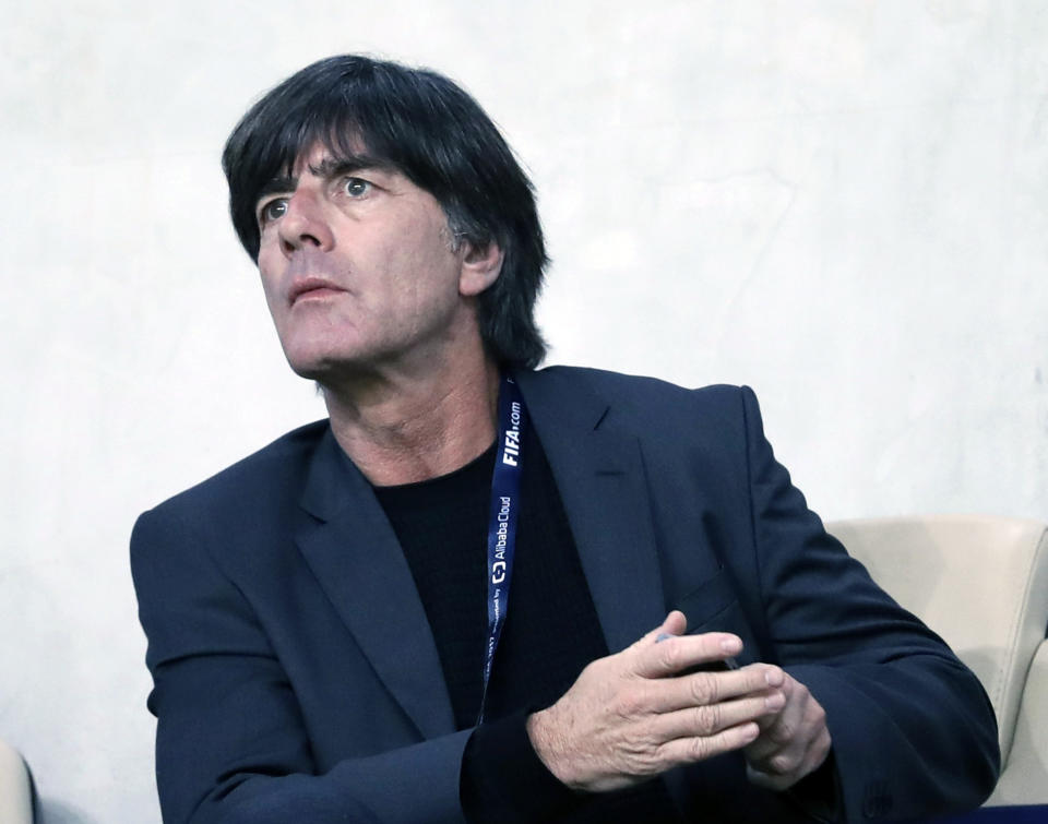 FILE - In this file photo dated Tuesday, Dec. 12, 2017, German national soccer team head coach Joachim Loew attends the Club World Cup semifinal soccer match between Gremio and Pachuca at the Hazza Bin Zayed stadium in Al Ain, United Arab Emirates. Loew was summoned to address FIFA’s World Cup coaches’ debrief in London Sunday Sept. 23, 2018, to explain Germany's ignominious elimination from the World Cup in Russia, “After such a long time at the top,” Loew said Sunday, “we were missing the last percent, the fire, the passion, and this greed to win a title no matter what.” (AP Photo/Hassan Ammar, FILE)