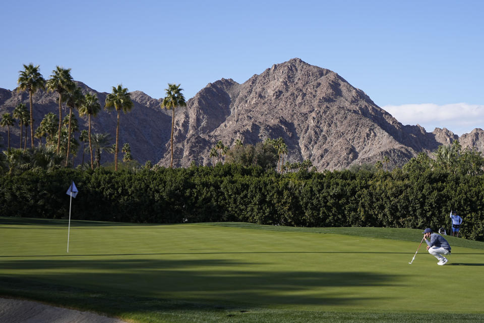 Davis Thompson lines up a putt on the 17th green during the American Express golf tournament on the La Quinta Country Club Course Thursday, Jan. 19, 2023, in La Quinta, Calif. (AP Photo/Mark J. Terrill)