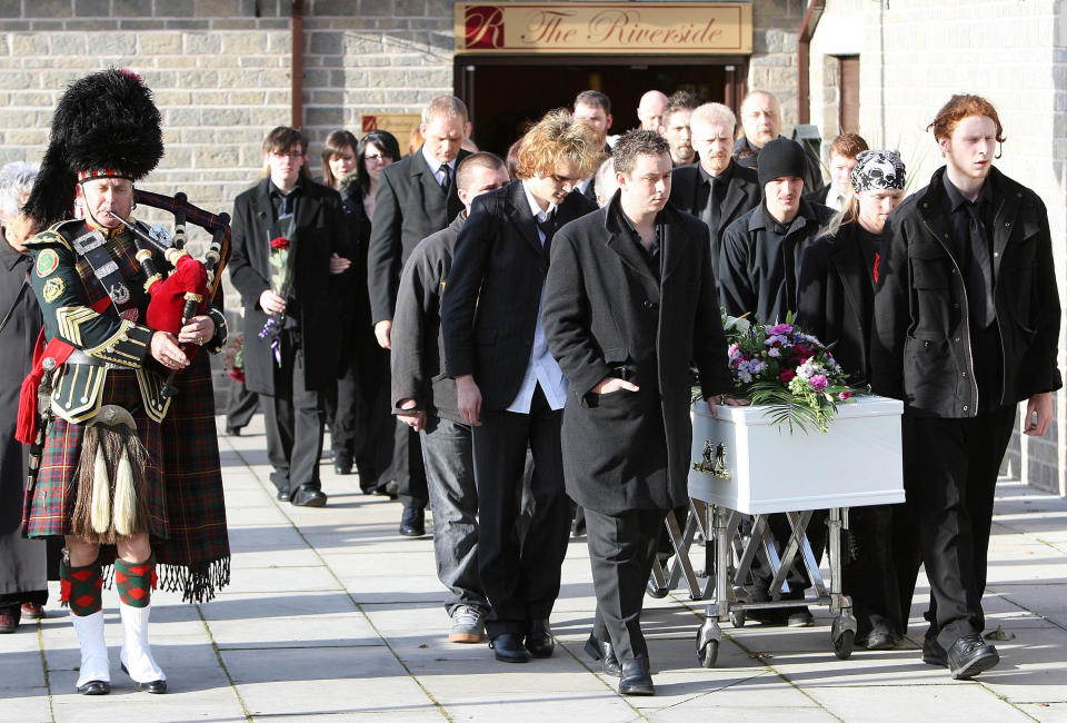 Mourners walk alongside the coffin of Sophie Lancaster, who was kicked to death in a park, following her humanist funeral at the Riverside Centre in Whitworth, Lancashire.