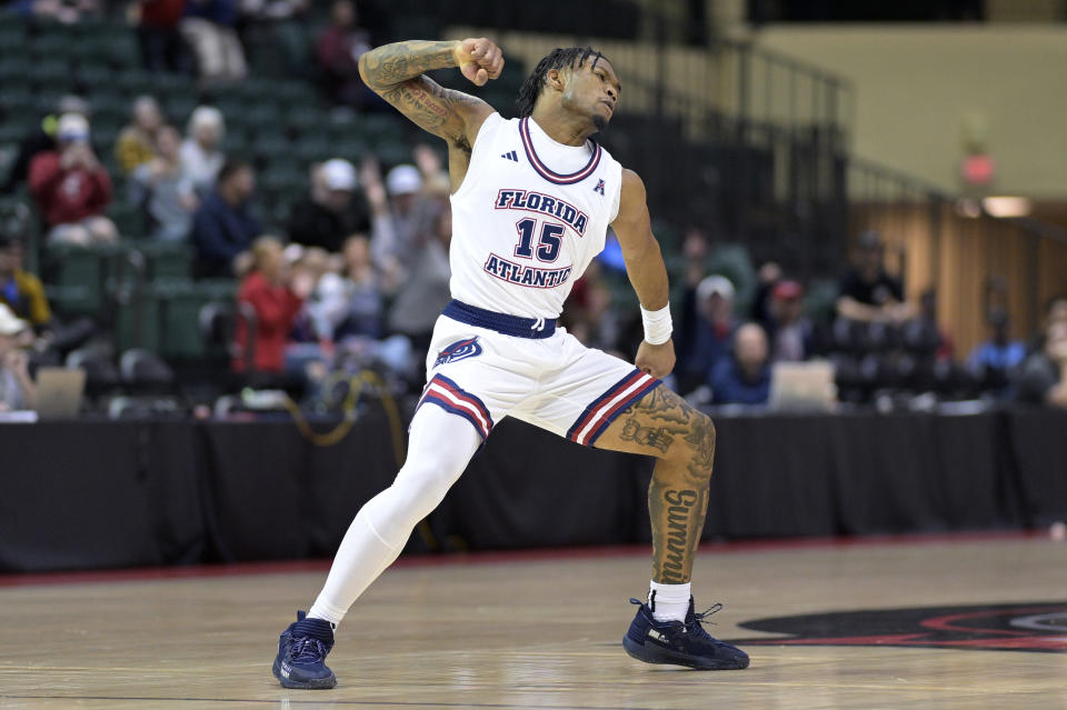 Florida Atlantic guard Alijah Martin (15) celebrates after scoring a 3-pointer during the first half of an NCAA college basketball game against Texas A&M, Friday, Nov. 24, 2023, in Kissimmee, Fla. (AP Photo/Phelan M. Ebenhack)