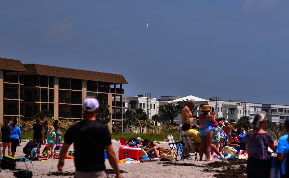 Launch of a SpaceX Falcon 9 rocket on a resupply mission to the International Space Station for NASA. Rocket launched from Pad 39A at Kennedy Space Center at 11:47 a.m. EDT Monday June 5th. The rocket was a small streak in the sky to beach goers at Cheri Down Park in Cape Canaveral. 