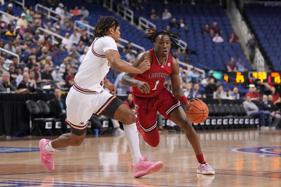 Mar 7, 2023; Greensboro, NC, USA; Louisville Cardinals guard Mike James (1) dribbles as Boston College Eagles guard DeMarr Langford Jr. (5) defends in the first half of the first round of the ACC Tournament at Greensboro Coliseum. Mandatory Credit: Bob Donnan-USA TODAY Sports
