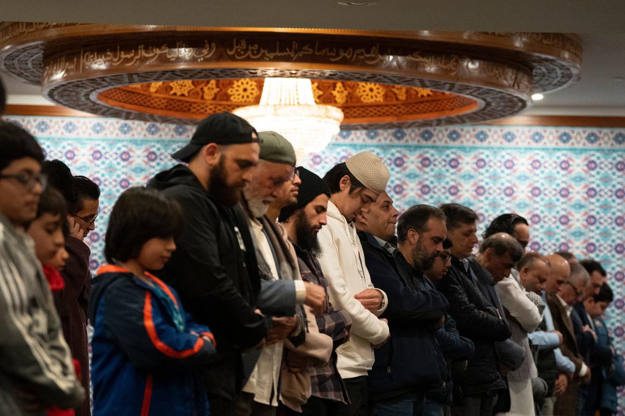 Mar 27, 2024; Boonton, NJ, USA; Attendees of an annual Interfaith Dinner at Jam-e-Masjid Islamic Center during the evening prayer.