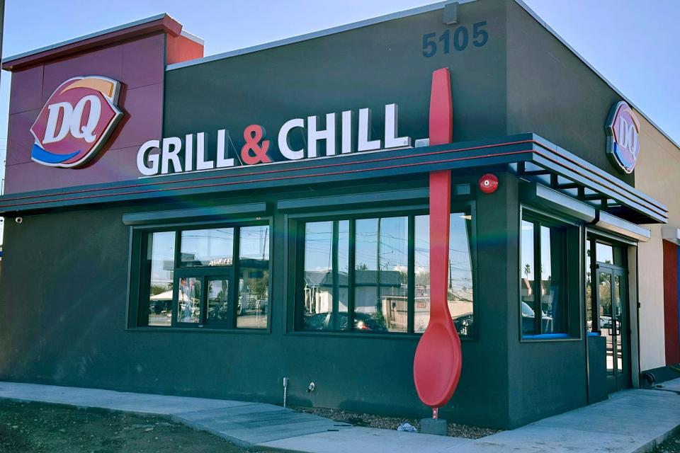 This undated image provided by Raman and Puja Kalra shows their Dairy Queen franchise restaurant in Phoenix with a 15-foot-tall red spoon. The owners remain perplexed — and slightly amused — as to why someone would steal the giant red spoon that adorned their restaurant.