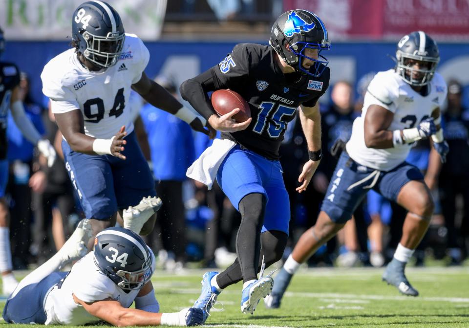 Buffalo quarterback Cole Snyder (15) scrambles for a gain against Georgia Southern linebacker Jon Ferguson (34), defensive lineman Elhadj Fall (94) and linebacker Marques Watson-Trent (33) during the Camellia Bowl held at Cramton Bowl in Montgomery, Ala., on Tuesday December 27, 2022. Credit: Mickey Welsh / Advertiser-USA TODAY NETWORK