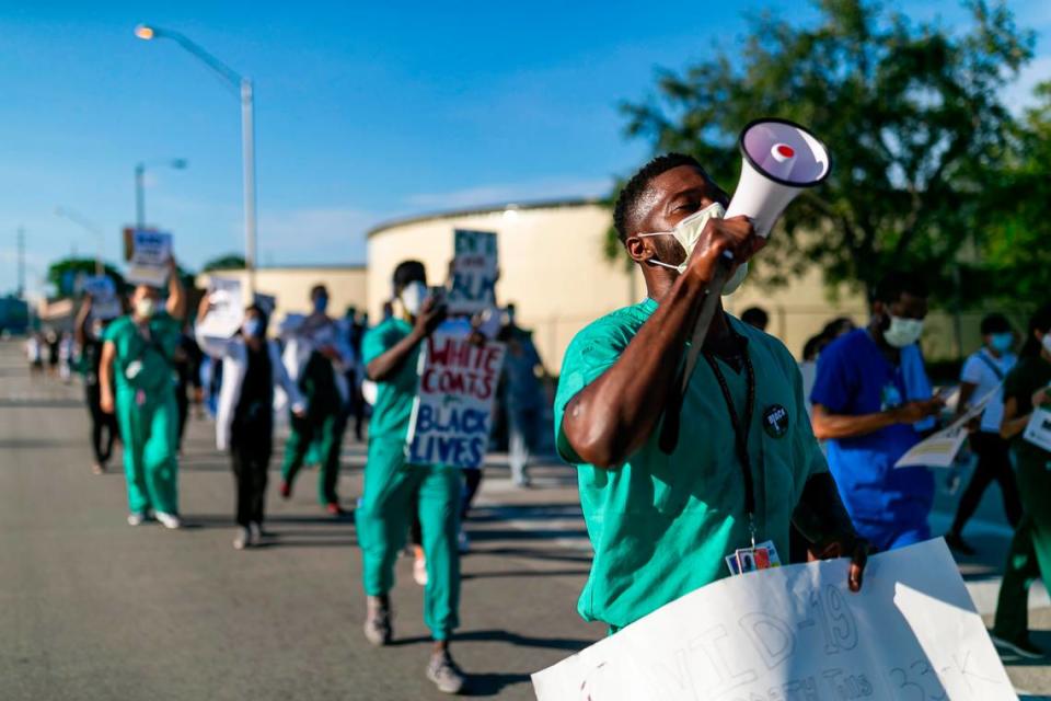 Dr. Anthony Okafor, 28, participates in a White Coats for Black Lives rally near Jackson Memorial Hospital in Miami, Florida on Tuesday, June 9, 2020.