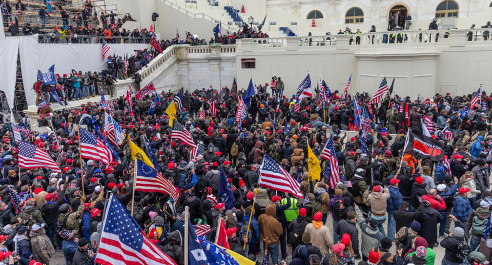 Pro-Trump protesters seen on and around Capitol building. Source: Getty Images