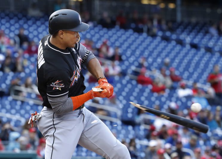 Miami Marlins' Giancarlo Stanton breaks his bat and grounds out to short during the fourth inning of the team's baseball game against the Washington Nationals in Washington, Thursday, April 6, 2017. (AP Photo/Manuel Balce Ceneta)