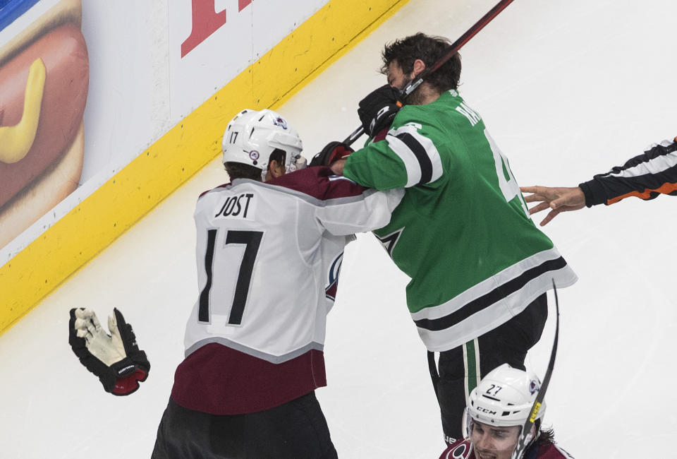 Dallas Stars' Alexander Radulov (47) and Colorado Avalanche's Tyson Jost (17) tussle during the third period of Game 3 of an NHL hockey second-round playoff series, Wednesday, Aug. 26, 2020, in Edmonton, Alberta. (Jason Franson/The Canadian Press via AP)