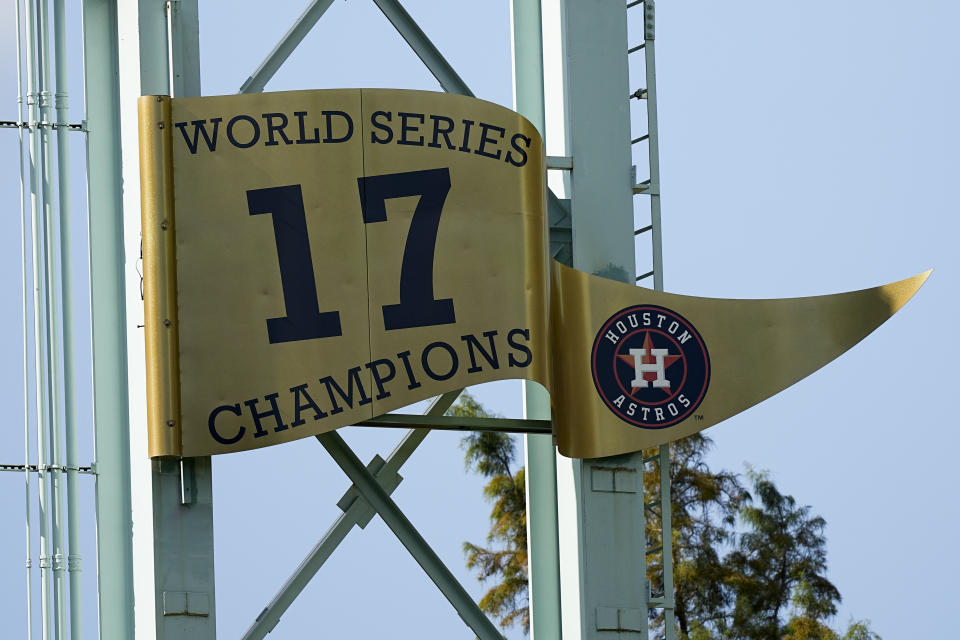 The Houston Astros World Series banner is seen Monday, Oct. 25, 2021, in Houston. The Astros face the Atlanta Braves in Game 1 of baseball's World Series tomorrow. (AP Photo/David J. Phillip)