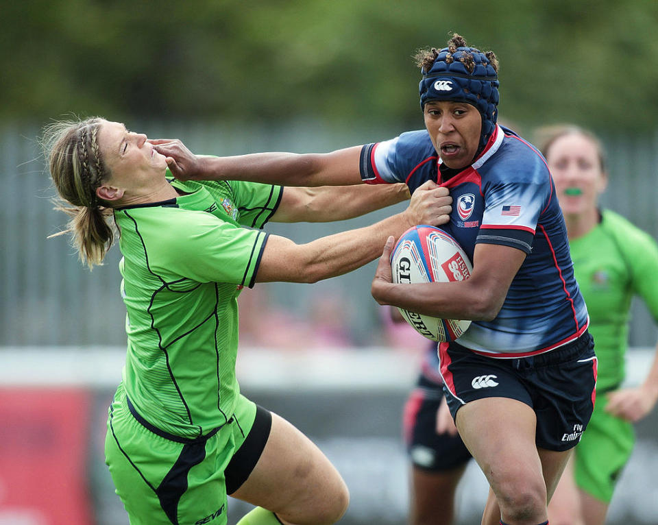 Nathalie protects the ball from a player on the rival team