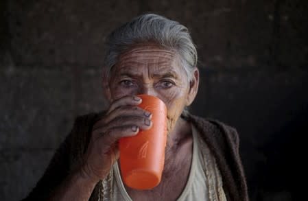 A woman drinks water in El Crucero town, Nicaragua February 27, 2016. REUTERS/Oswaldo Rivas