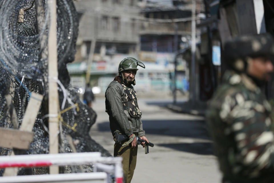 Indian paramilitary soldiers stand guard outside a closed market during a strike in protest against the ban on Jama'at-e-Islami, in Srinagar, India, Tuesday, March 5, 2019. India has banned Jama'at-e-Islami, a political-religious group in Kashmir, in a sweeping and ongoing crackdown against activists seeking the end of Indian rule in the disputed region amid the most serious confrontation between India and Pakistan in two decades. (AP Photo/Mukhtar Khan)