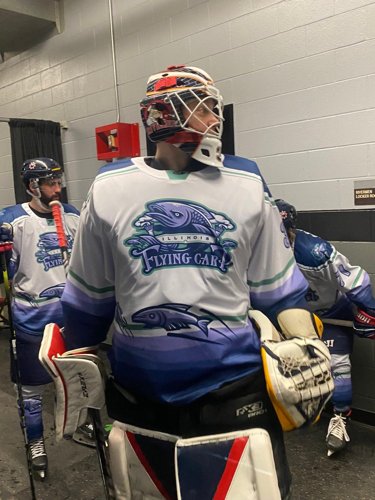 Veteran goaltender Eric Levine gets ready to lead the Illinois Flying Carp out as they re-brand from the Peoria Rivermen for one night and beat Quad City, 3-2, on March 10, 2023 at Carver Arena.